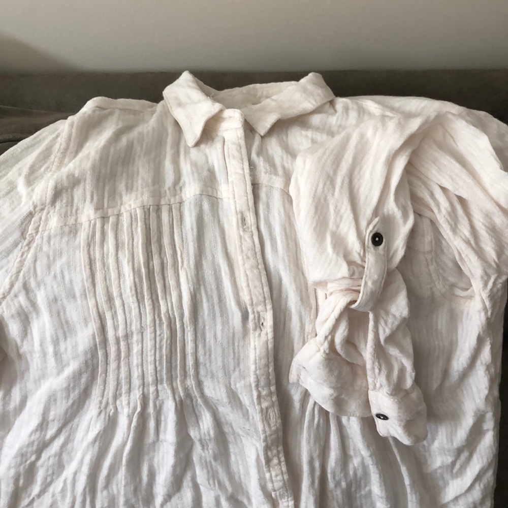 Long sleeved cream blouse